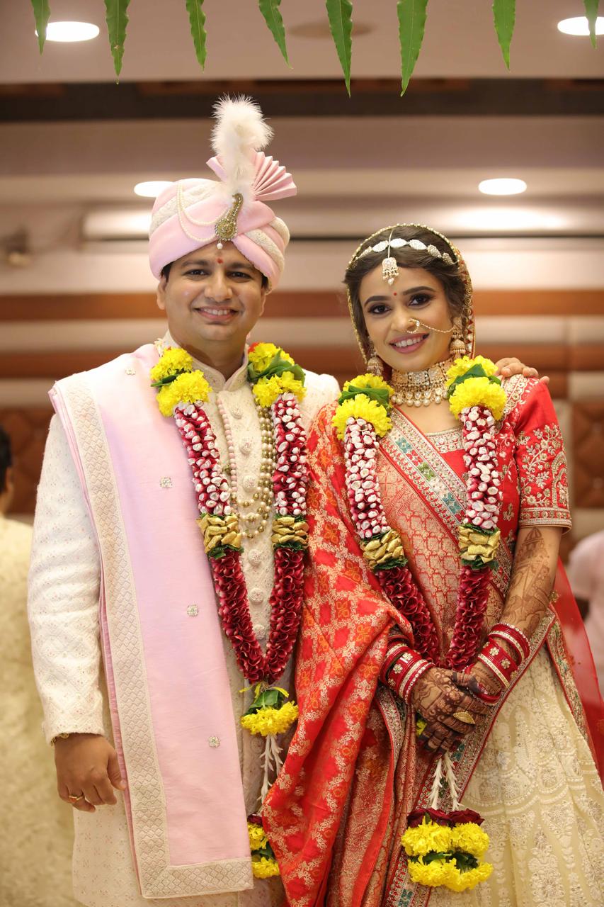 Sonal with her partner in traditional wedding attire
