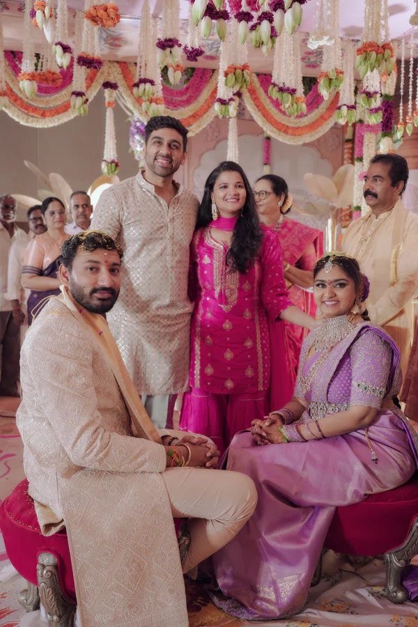 Akshitha celebrating with the newlywed couple